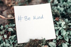 #BeKind on a post-it note.