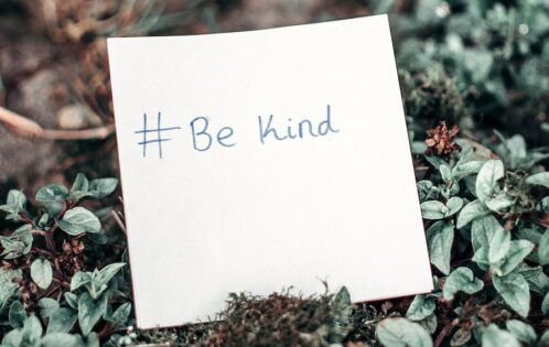#BeKind on a post-it note.