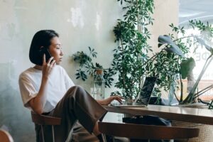 Woman on phone working.