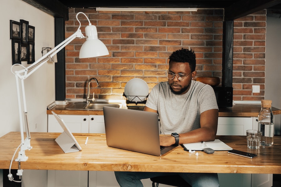 Man working at a computer.