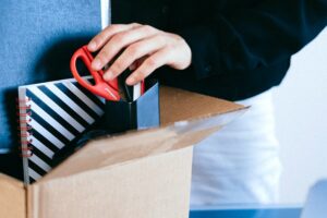 Close up of a worker packing up.