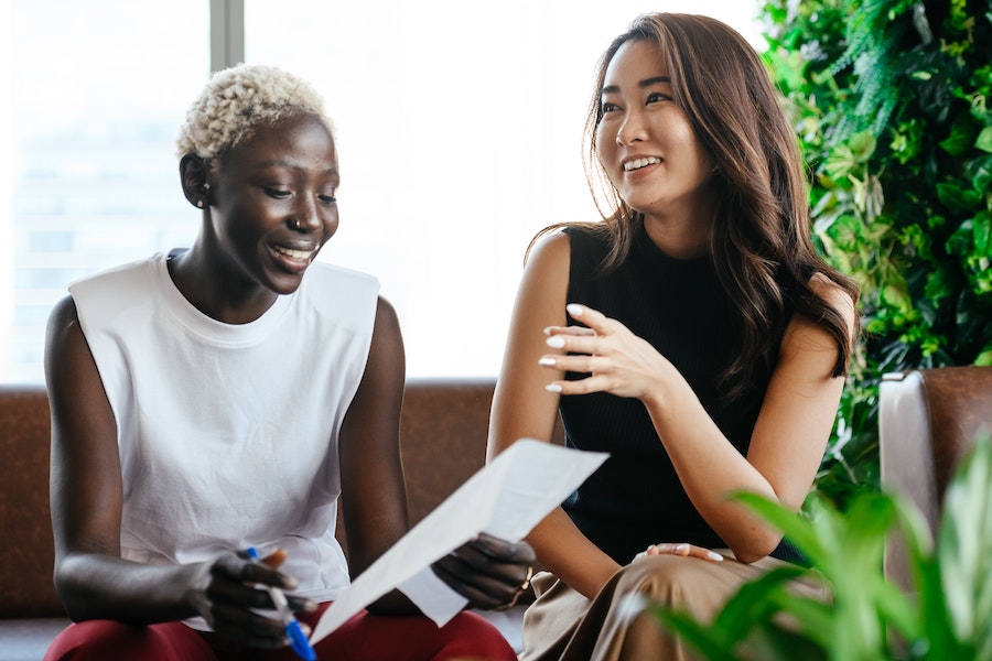 Two women, happy at work.