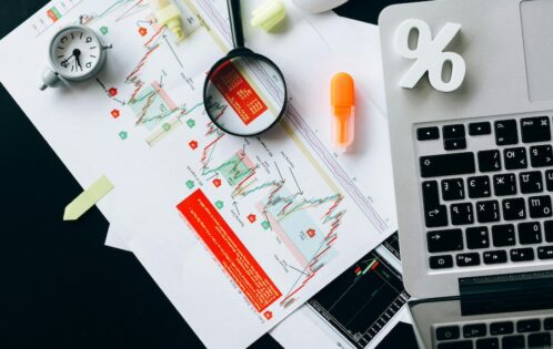 Desk filled with charts, tools, and computations.