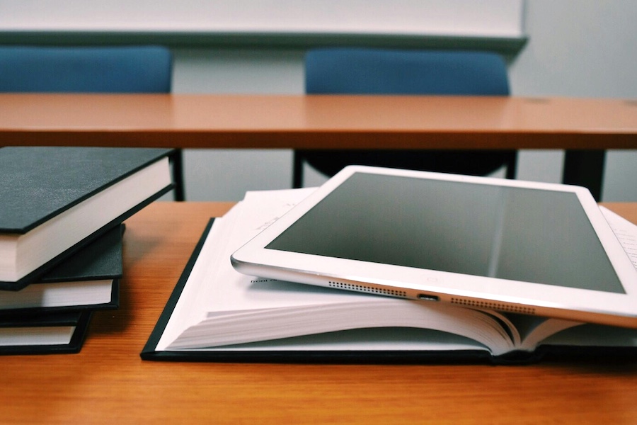 Educational space with a notebook and a tablet.