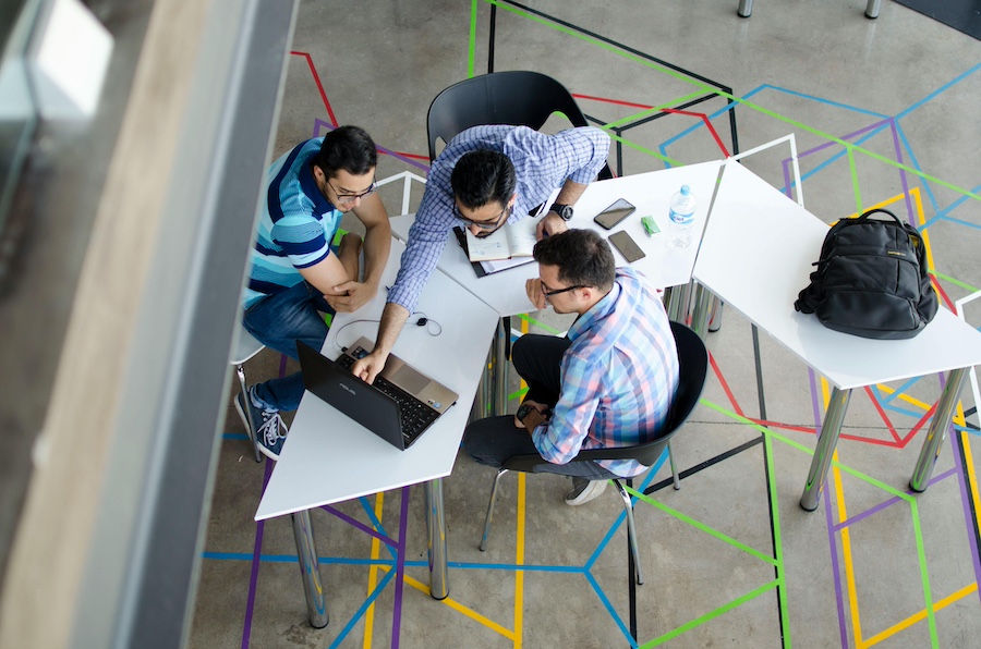 Professionals meeting at a work table.