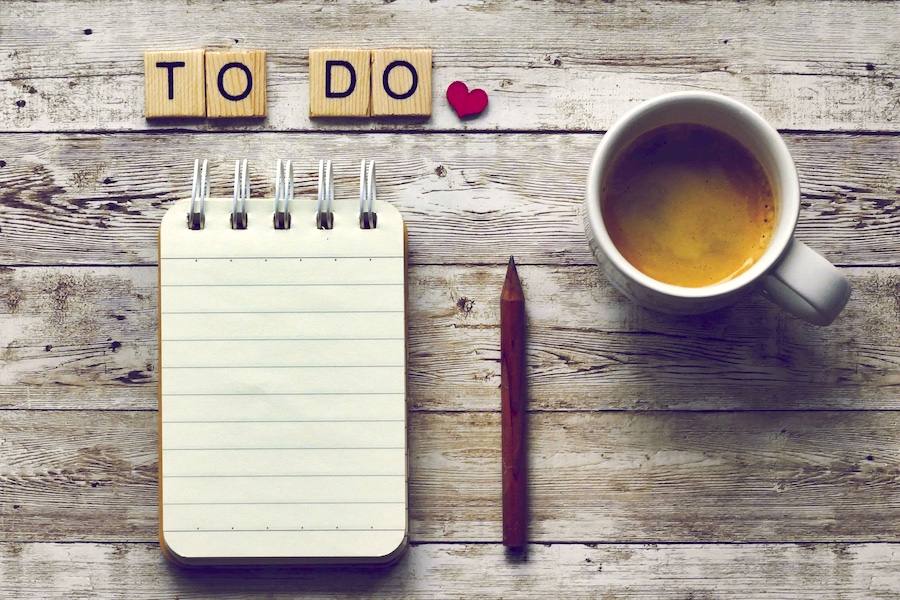 Desktop with a fresh to-do list and a cup of coffee.