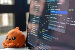 AI information on a laptop screen with a fun stuffed toy nearby.